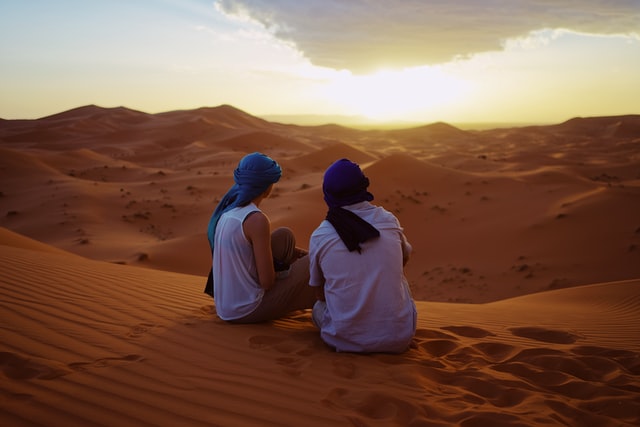 A scenic sunset in the Sahara Desert, part of luxury Morocco tours.