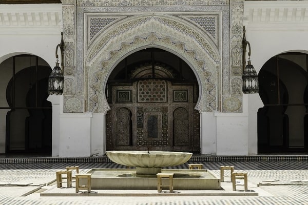 Ornate Moroccan gate with intricate patterns and traditional design featured on 5-day tour from Fes to Marrakech