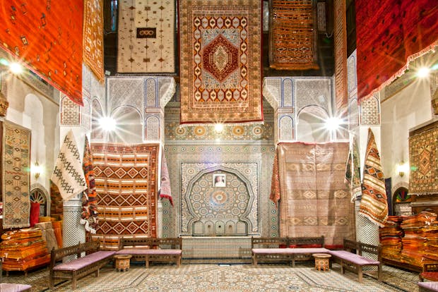 Traditional Moroccan Bazaar with Colorful Tapestries and Handcrafted Rugs